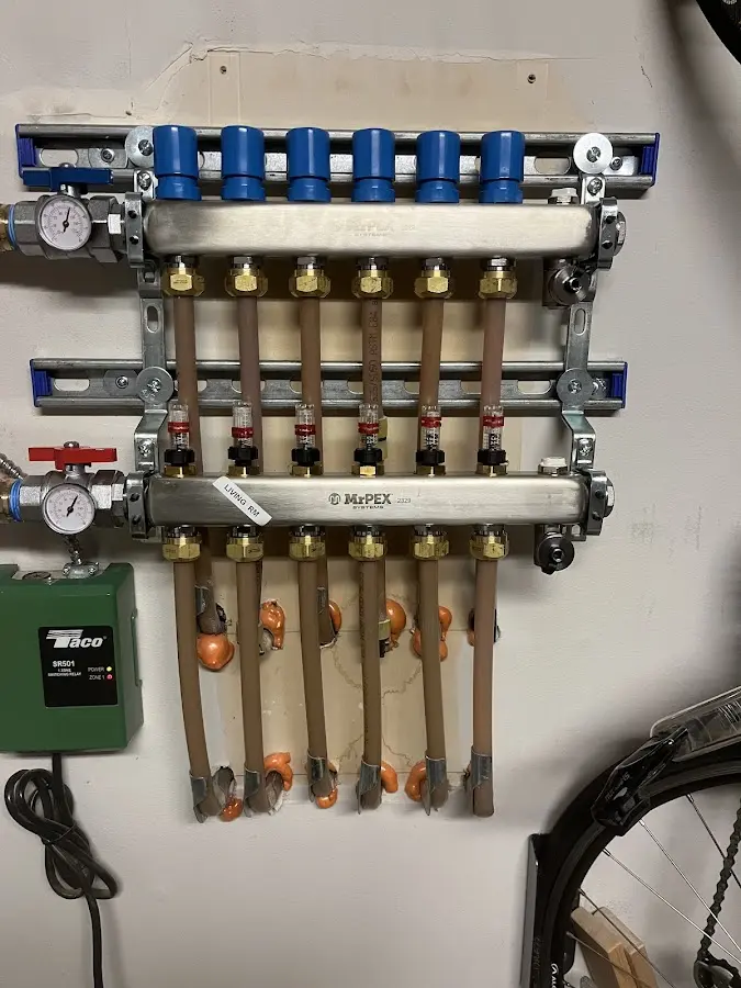 Plumber performing Water Heater Repair at a residential property in New London